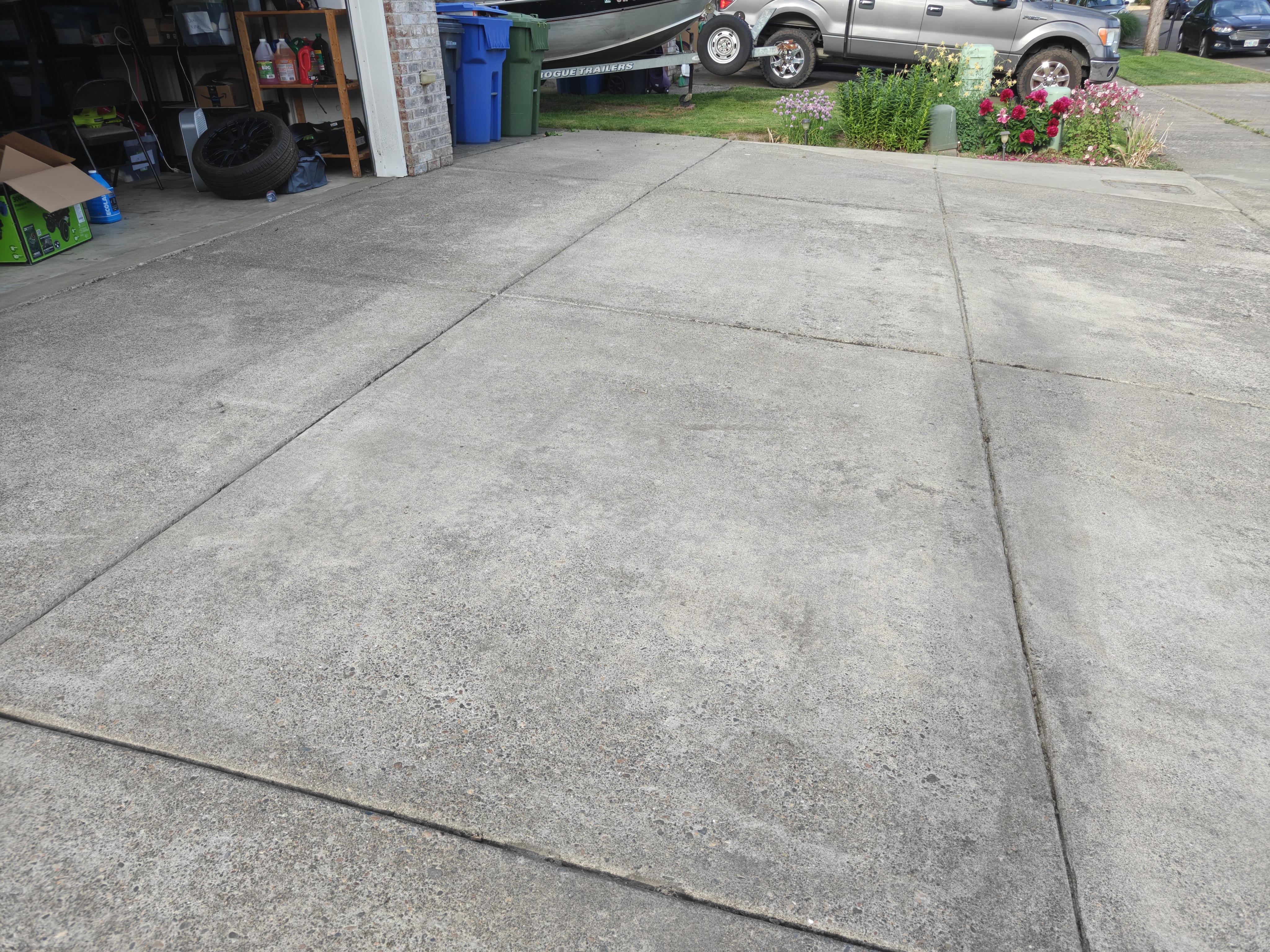 Driveway after pressure washing — clean, bright concrete